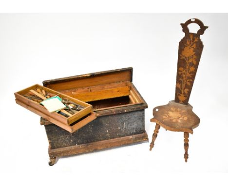 A vintage wooden toolbox containing a quantity of assorted vintage hand tools, to include chisels, spanners, measures, files,