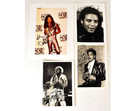 Four photographs bearing signatures, including Lenny Kravitz, Maxi Priest, Morris Day and another Maxi Priest (4).We have not