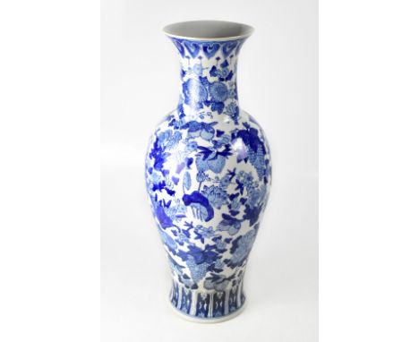 A large modern Chinese blue and white transfer decorated vase of baluster form, with short neck and flared rim, decorated wit