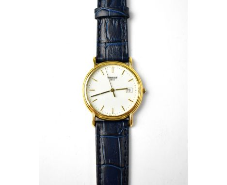 TISSOT; a gentlemen's 18ct gold gentlemen's watch, the white enamelled dial set with raised gold baton numerals, on blue Inox