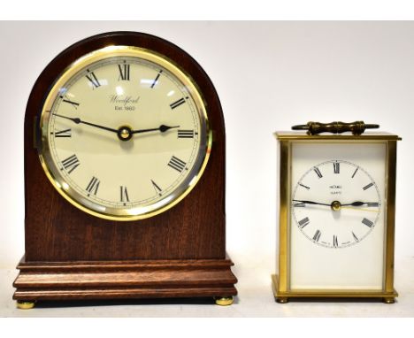A modern Woodford battery-operated mahogany dome shaped mantel clock, the circular dial set with Roman numerals, height 22cm 