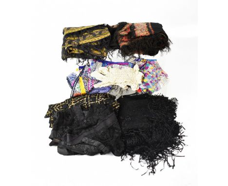 A group of vintage and antique textiles to include two lace waistcoats, two 19th century table covers, black lace shawl, lace