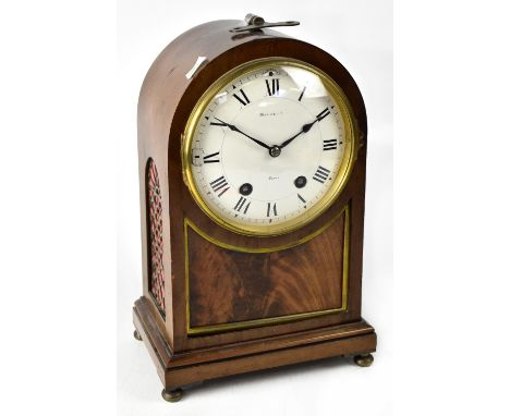 MAPLE &amp; CO; a mahogany dome case mantel clock, the painted dial set with Roman numerals with maker's name 'Maple &amp; Co