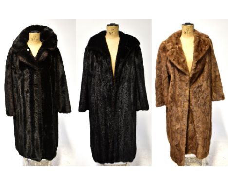 Two vintage fur coats comprising a circa 1960s caramel full-length fur with fold-back reveres, a similar period black mink co