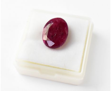 A loose 9 carat oval ruby with AGSL Gem Identification Report. 