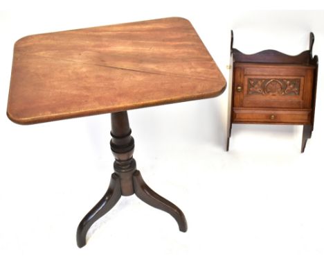 An early 19th century mahogany tripod table with tilt top and catch, on pedestal column to three splayed supports and a wall-