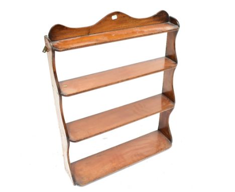 A 19th century mahogany wall-hanging waterfall shelf unit, with curved top, 82 x 63.5 x 19cm.