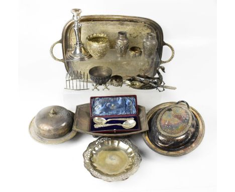 A quantity of silver plated and Eastern white metal items, to include toast rack, twin-handled tray, muffin dish, candlestick