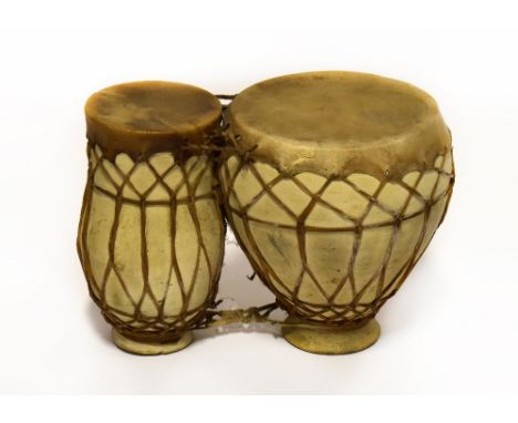 A pair of 1960s vintage goatskin and pottery drums.