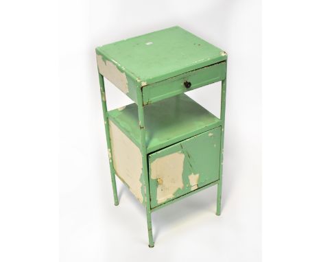 A vintage distressed green painted dentist's side table, with dished top above single drawer and open shelf above single cupb