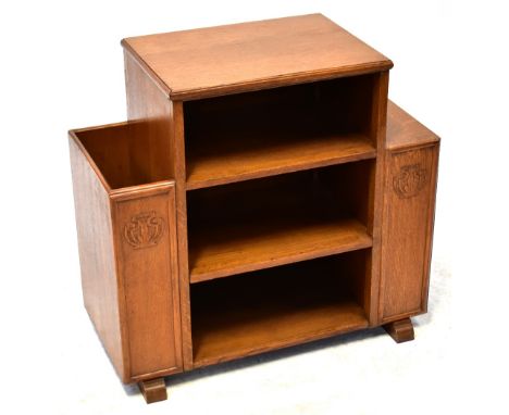 A vintage oak radio stand with three central shelves flanked by a two-shelf bookcase and magazine/newspaper pocket, with carv