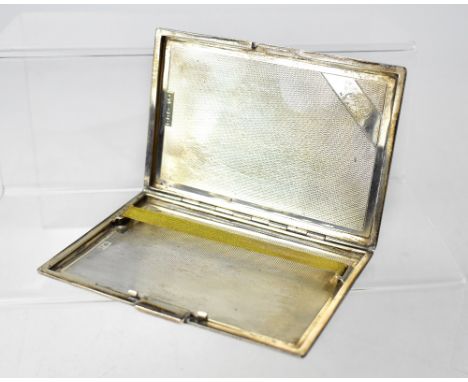 A George VI hallmarked silver engine turned cigarette case, London  1941, length 12.5cm, approx 5.9ozt.