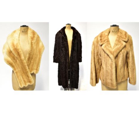 Three vintage furs comprising a circa 1960s caramel mink waist-length swagger jacket with flared sleeves, a circa 1950s cream