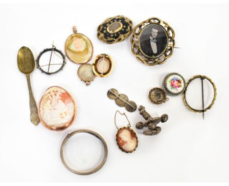 A collection of various brooches to include three Victorian mourning examples, all yellow metal, image of a Victorian gentlem