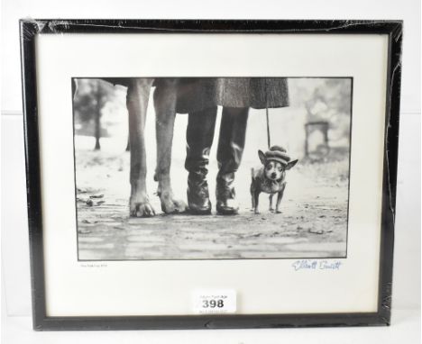 ELLIOTT ERWITT (born 1928); a signed print, untitled, but possibly 'Felix, Gladys and Rover 1974', depicting the front legs o