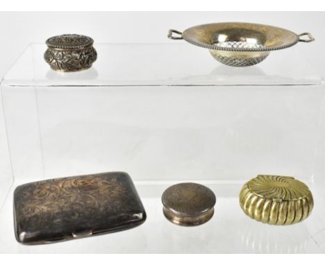 Two silver snuffboxes of circular form, one repoussé decorated with Rococo scrolls, the other engine turned with blank cartou