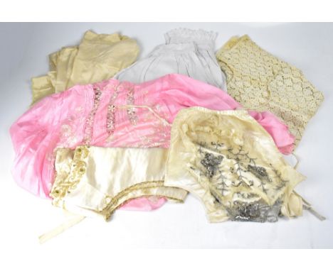 A collection of vintage clothing and textiles to include a cream satin bib overlaid with beaded and sequinned mesh panel, a l