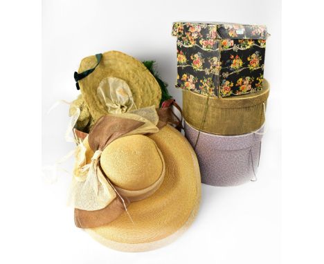 Four vintage hat boxes to include a Marshall &amp; Snelgrove black floral box containing a 1930s trilby-style hat with black 