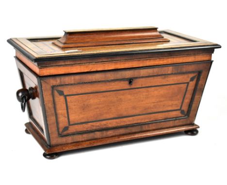 A good early 19th century mahogany rosewood cross banded and inlaid tea caddy of sarcophagus form, the hinged lid with satinw