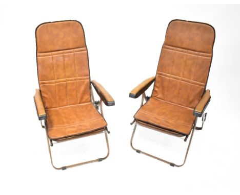 A pair of vintage tan leather and chrome-framed folding garden recliners, with pull-out leg rests (2). CONDITION REPORT These