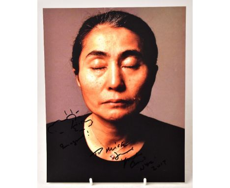 YOKO ONO; a photograph of the star bearing inscription, doodle and signature, 25 x 20cm.We have not authenticated these signa