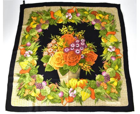 CHRISTIAN DIOR; a silk scarf, black ground with Autumn roses and flora in a basketweave border filled with luscious vegetable