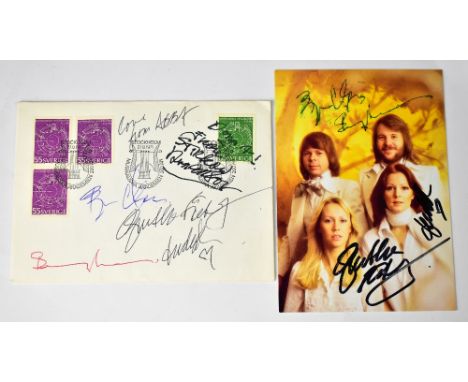 ABBA; an envelope with postal mark for Stockholm 1971 bearing the four band members' signatures and a photograph bearing sign