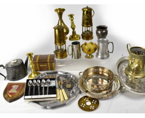 A large quantity of mixed plated and metalware to include trays, wine bottle holders, candlestick, tankards, goblets, cutlery