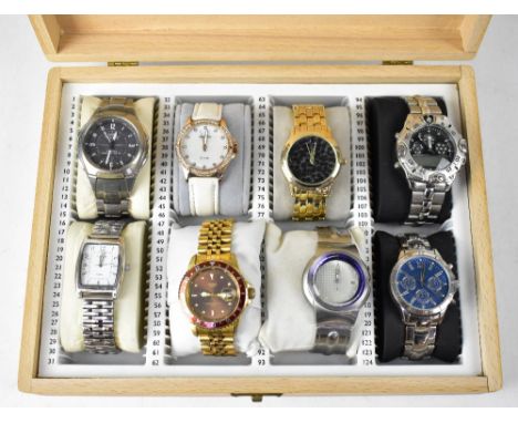 A wooden case containing eight dress watches, to include Casio, Citron Quartz, two Sekonda examples, Storm, etc (8).