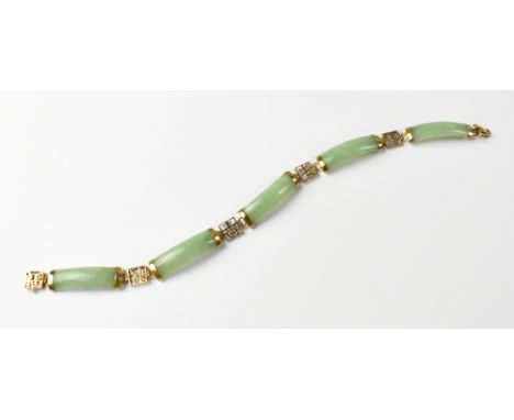 A 14ct yellow gold and green jade rectangular panel bracelet.
