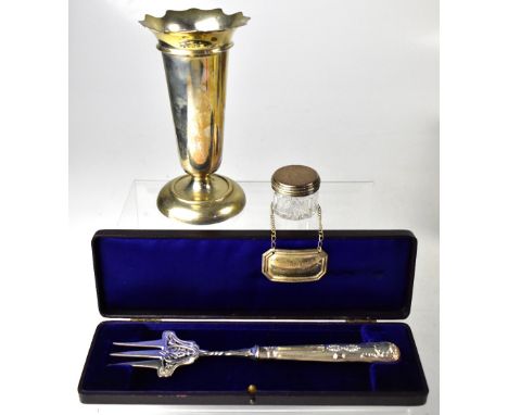 A collection of hallmarked silver items comprising a trumpet vase, a silver topped dressing table jar, a bottle label marked 