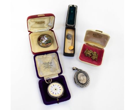 An early 20th century hallmarked silver oval locket, a Victorian 1889 crown with enamelled image of Saint George and the Drag