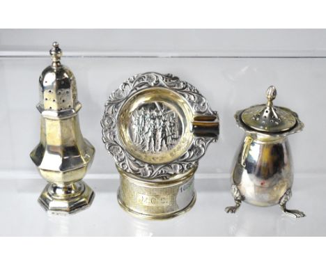 Two non-matching hallmarked silver pepper pots, a single engine turned silver napkin ring, and a white metal ashtray with pur