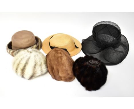 Three vintage circa 1950s and 60s mink fur hats comprising one dark brown example with brown leather flower to the top, one i