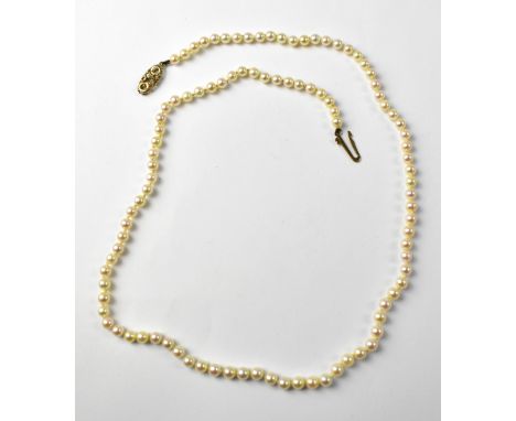 A 9ct gold mount seed pearl necklace, the clasp with pierced circles and ropetwist decoration, stamped 375, length 47cm, appr