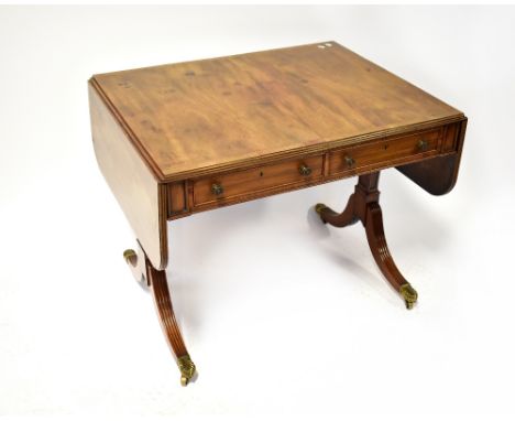 GORDON &amp; WATSON; a Regency mahogany sofa table, the crossbanded top with drop ends above a pair of frieze drawers to each