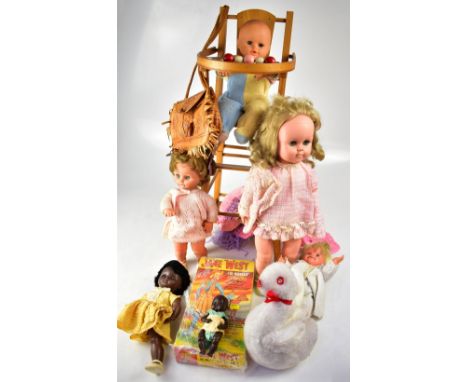 A group of vintage celluloid dolls, various sizes and makes, some in original clothing, some with homemade clothing, a dolls'