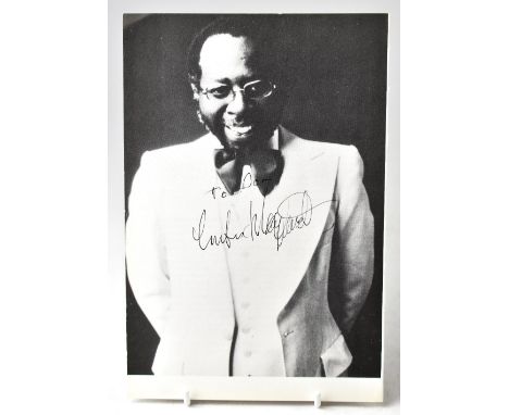 CURTIS MAYFIELD; a page from a book or magazine bearing the stars signature, 23 x 15cm.We have not authenticated these signat