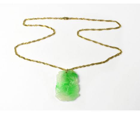 A 9ct yellow gold twist link chain necklace with a green jade pendant, weight including pendant approx 12.3g.