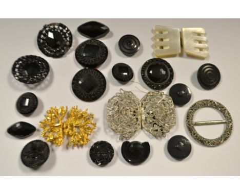A Victorian jet button, others, a mother of pearl buckle etc