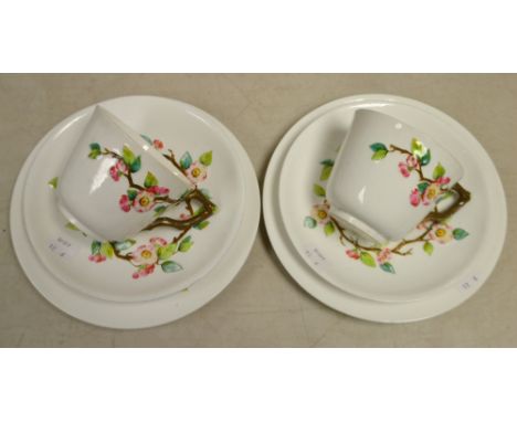 A pair Royal Worcester trios relief decorated with floral trailing vines, printed green marks (6)