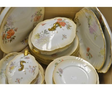 A Doulton Burslem dinner service, transfer printed with summer flowers on a blush ground, comprising sauce boat and ladle on 
