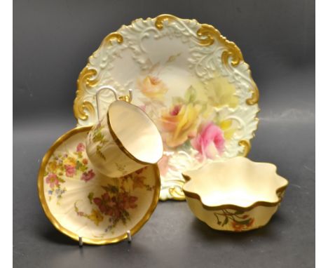 A Royal Worcester teacup and saucer, the cup moulded in relief with peals, the saucer with veins, printed and pained with col