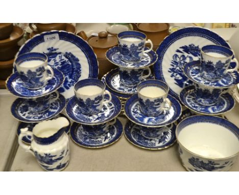 A Staffordshire blue and white oriental tea service, comprising two cake plates, twelve tea plates, twelve cups and saucers, 
