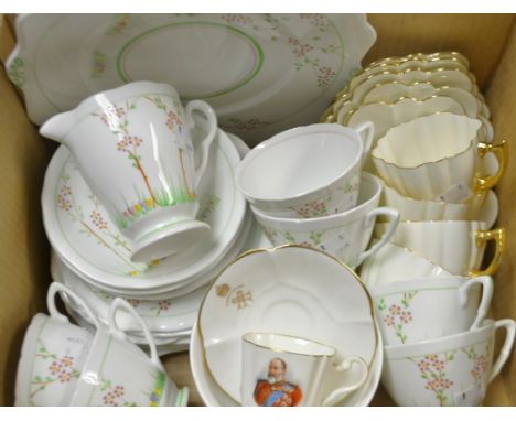 An Art Deco Royal Stafford tea set painted with summer flowers, comprising six cups, four saucers, six tea plates, milk and s