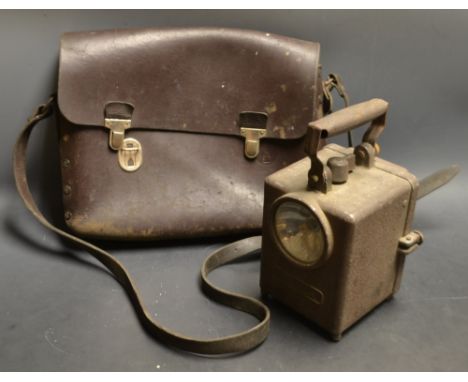 A French Wonder Agral type railway hand lamp;  a S N C F train drivers leather shoulder pouch, stamped marks (2)
