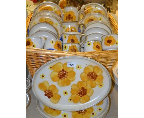A Denby Poppy dinner service, comprising six oval plates, six side plates, two mugs, six cups and saucers 