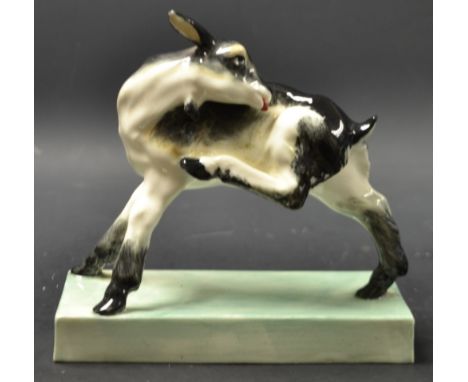 A rare Royal Worcester Goat, modelled by Bargas, standing with it's leg raised itching,  green rectangular base,  14cm high, 