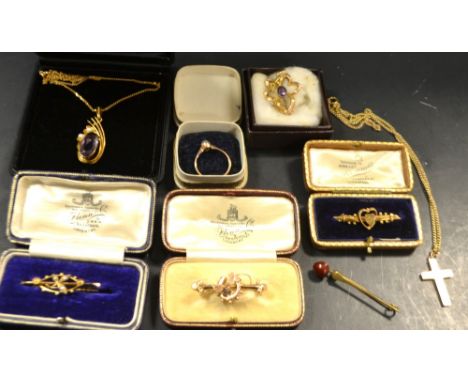 A Victorian 9ct gold bar brooch; another set with seed pearls; others, 8g gross; a 9ct gold pendant, set with purple stone; a