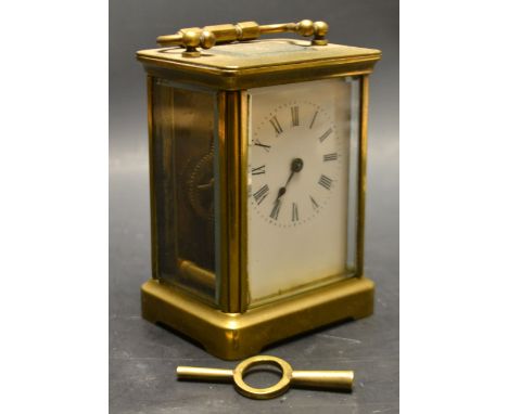 A French brass carriage clock, marked R & Co ,Paris, with a key.